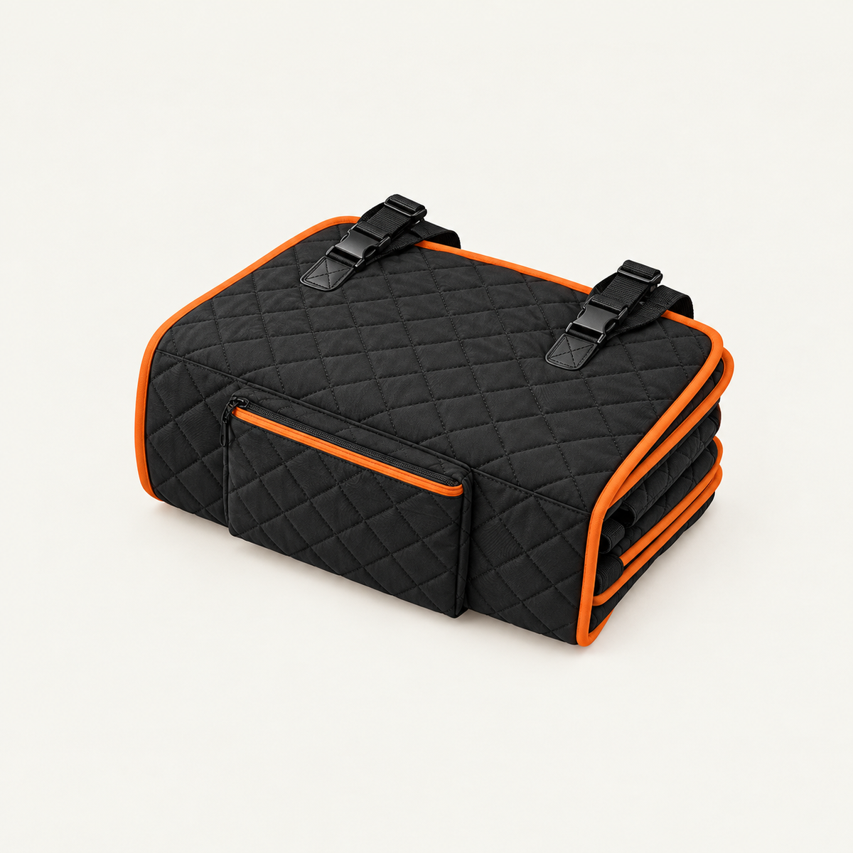 the seat cover folded down into a compact rectangle with its straps tucked, showing the side storage pocket