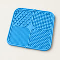 Blue silicone lick mat with four textured zones: honeycomb, raised bones, fine ridges and small nubs