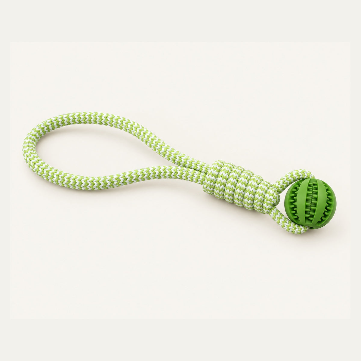 Green braided rope dog tug toy with treat dispensing rubber ball
