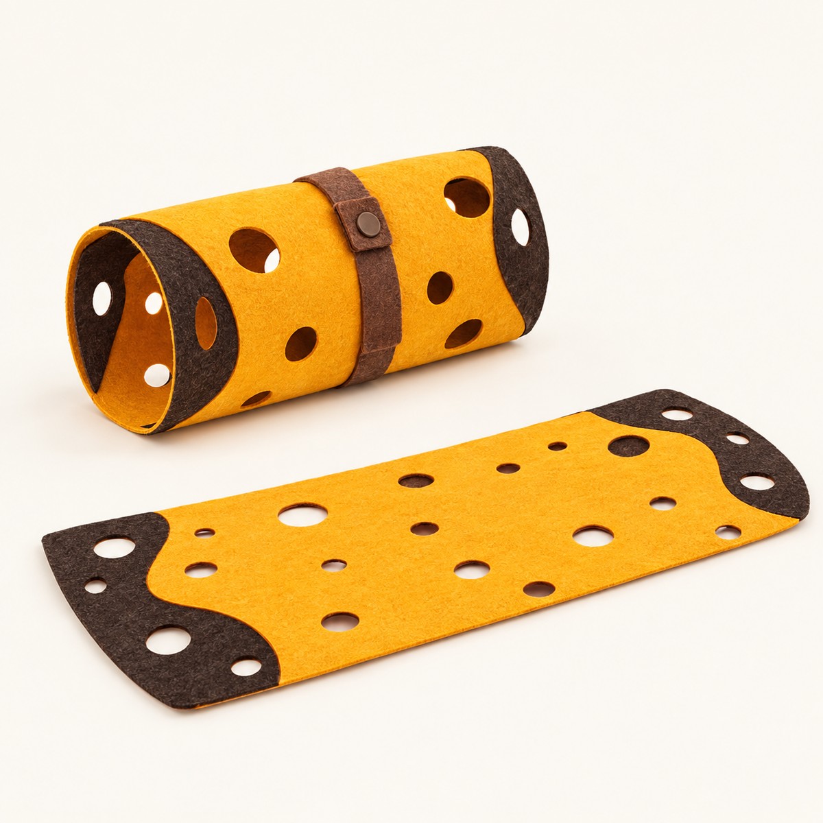 Mustard yellow felt cat play mat with dark brown cut-out holes rolled into a tunnel and fastened with a brown felt strap, with a second piece lying flat beside it