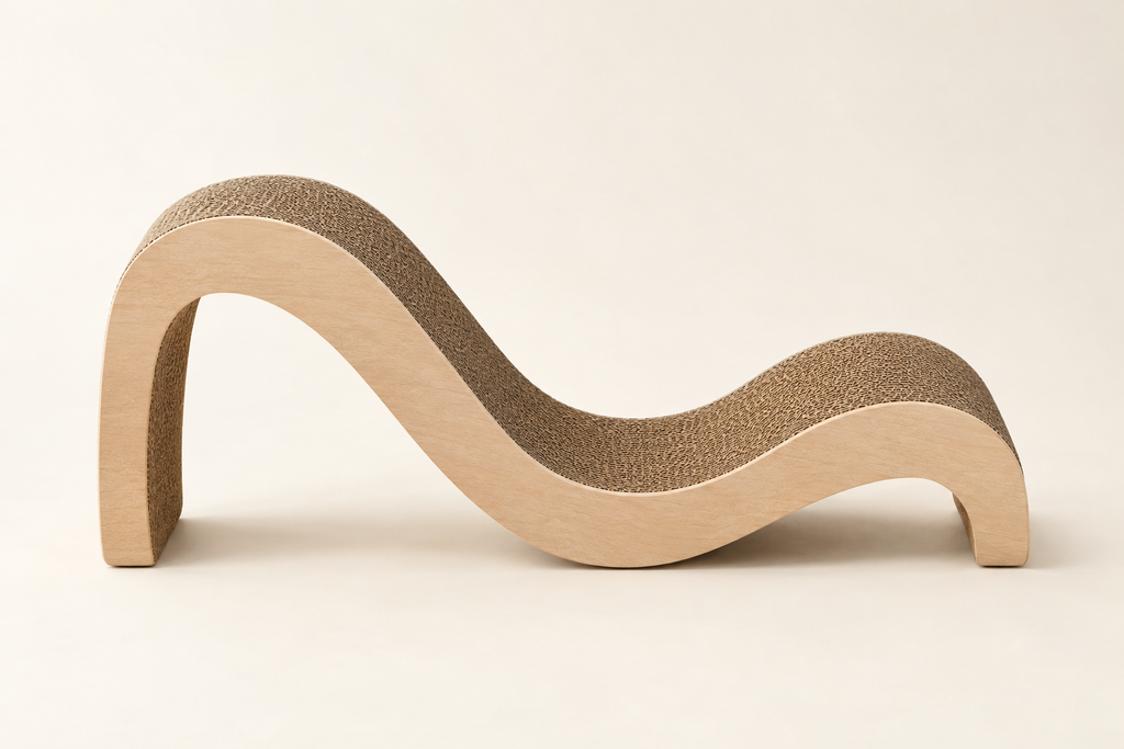 The same curved cat scratch lounger from the side showing the full height and the S-curve profile on a warm cream background.