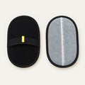 Two oval pet grooming mitts, one showing the black mesh top face with elasticated hand strap, the other turned to show the grey microfibre reverse